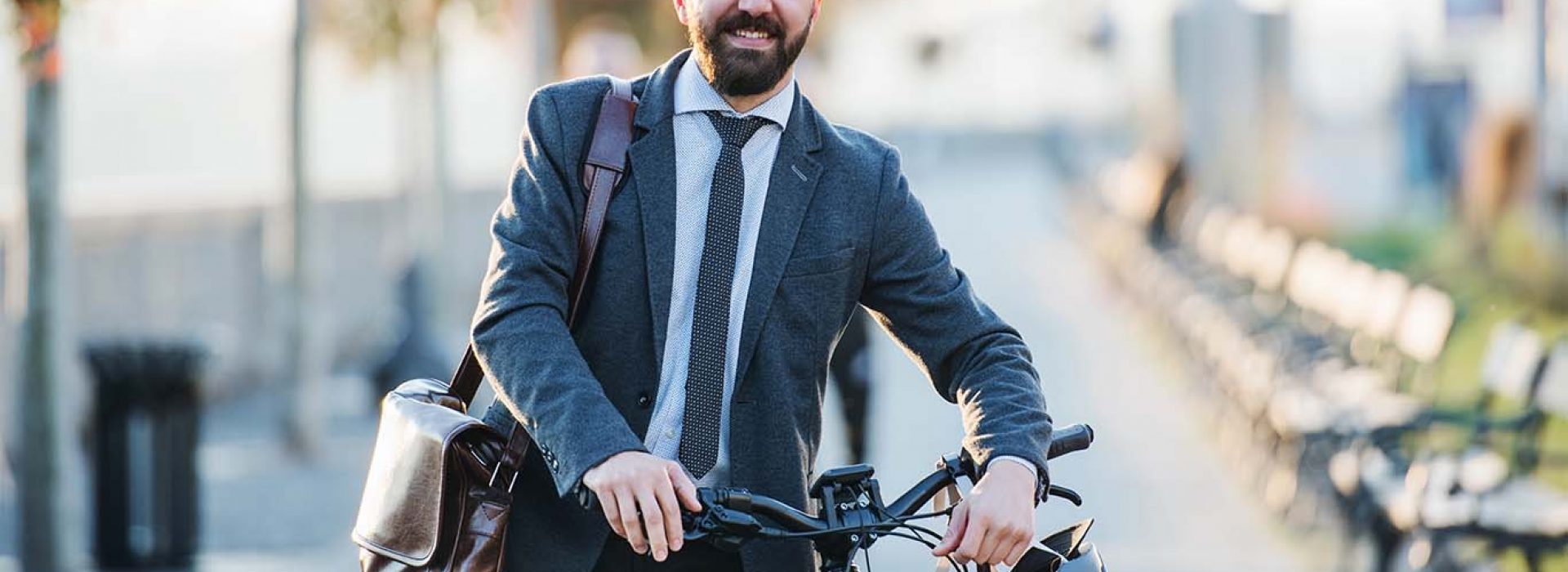 businessman-commuter-with-bicycle-walking-home-RDKSJ3E-copy